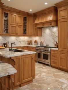 a large kitchen with marble counter tops and wooden cabinetry, along with stainless steel appliances