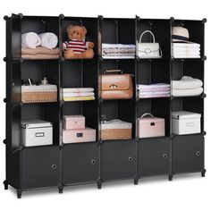 This 20-cube storage organizer offers ample space to store toys, bags, books, and other household items, helping to control clutter and keep your space organized. Designed with thickened PP panels and a sturdy metal frame, it ensures durability and safety for homes with children. The doors feature magnetic suction for easy access, and the sleek design complements any room style. Perfect for bedrooms, kids' rooms, or utility spaces, this lightweight storage solution is easy to assemble and maint… Cube Shelf Diy, Cube Shelves Diy, Bookshelf Wardrobe, Shelf With Doors, Modular Clothing, Plastic Cube, Shelves For Home Office, Storage For Bedroom, Cube Storage Organizer