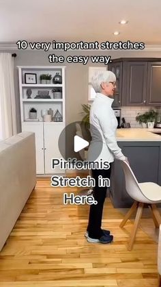 an old woman is cleaning the kitchen with a mop