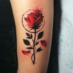 a red rose tattoo on the arm