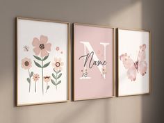 three pink and white wall art pieces with the letter n, name n, and flowers