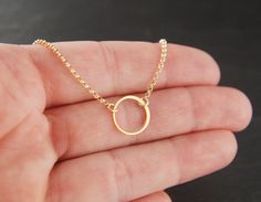 Small gold circle link and gold filled necklace, tiny circle necklace, infinity necklace, simple gold necklace, gold ring A 24 karat over sterling silver round link (12mm) is suspended from a 14 karat gold filled chain that can be up to 22 inches in length. The chain is secured with a 14 karat gold filled clasp. The circle is made of round wire and the other part is flattened wire. Your purchase will arrive in a jewelry box ready for gift giving or as a gift for yourself! Enter my shop here: jer Yellow Gold Open Circle Jewelry With Adjustable Chain, Tiny Gold Hoop Jewelry, Hypoallergenic 14k Gold-filled Round Pendant Jewelry, Hypoallergenic 14k Gold Filled Round Pendant Jewelry, Hypoallergenic 14k Gold Filled Round Pendant, Minimalist 14k Gold Filled Round Pendant Jewelry, Delicate Circle Chain In Yellow Gold, Dainty Clavicle Chain With Open Circle Pendant, Dainty Open Circle Clavicle Chain Jewelry