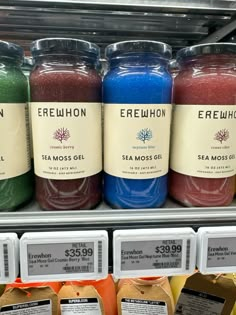 there are many different types of candles on the shelf in the store, including one for each