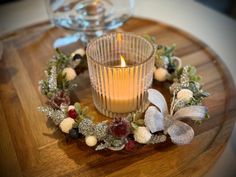 a candle sitting on top of a wooden table