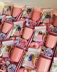 many pink mugs are stacked on top of each other with pictures and flowers in them