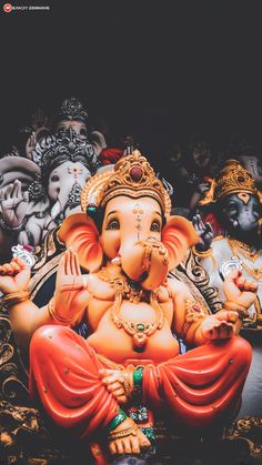 a statue of an elephant sitting on top of a table