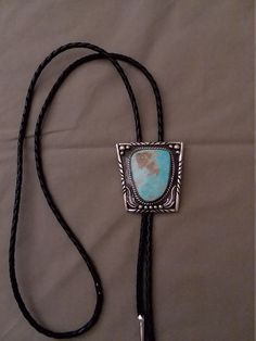 Sterling silver with turquoise bolo tie Formal Lariat Jewelry With Adjustable Cord, Elegant Blue Concho Jewelry, Elegant Blue Jewelry With Concho Detail, Adjustable Southwestern Bolo Tie For Formal Occasions, Southwestern Style Adjustable Bolo Tie For Formal Occasions, Southwestern Style Formal Bolo Tie, Elegant Concho Bolo Tie, Silver Western Bolo Tie, Classic Silver Bolo Tie As Gift