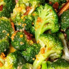 broccoli florets and other vegetables with chopsticks in a bowl