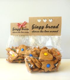 two bags of gingerbread cookies sitting next to each other