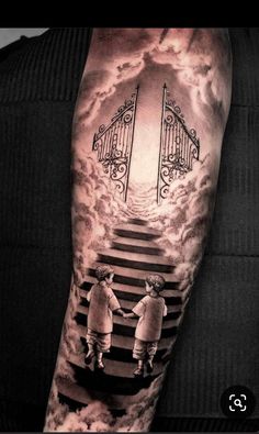 a man with a tattoo on his arm that has stairs leading up to the sky