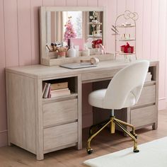 a white chair sitting in front of a desk with a mirror on top of it