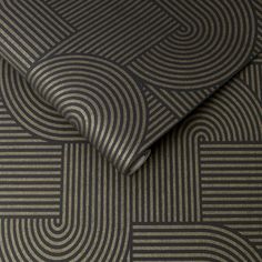 a close up view of a black and grey wallpaper with an abstract design on it