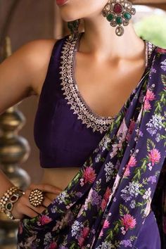 Purple pant saree with floral printed pallu. Comes with embroidered sleeveless blouse.
Component: 2
Pattern: Print and Embroidery
Type Of Work: Floral Print, Dabka and Sequin
Neckline: U neck
Sleeve Type: Sleeveless
Fabric: Crepe; Lining: Shantoon
Color: Purple
Other Details: 
Sequin embroidered neckline
Back cutout with tie up
Closure: Side zip
Occasion: Sangeet - Aza Fashions Luxury Purple Blouse With Resham Embroidery, Pant Sari, Pant Saree, Floral Pant, Print And Embroidery, Crepe Pants, New Saree Blouse Designs, Latest Model Blouse Designs, New Blouse Designs