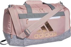 Keep your options open with this adidas duffel bag. Ready for whatever workout your trainer throws at you, this small-size bag lets you easily pack up your gear thanks to a roomy main compartment and zip pockets at the ends. A pad on the carry strap keeps things comfortable even when your bag feels heavy. Fit & Design: Dimensions: 20.5" x 11" x 11.75" Volume: 44.5 L Durable fabric Front zip pocket and end zip pockets Adjustable detachable shoulder strap with movable pad Dual carry handles with p Cute Gym Bag, Adidas Duffle Bag, Cute Summer Shirts, Feels Heavy, Cheer Bag, Team Branding, Adidas Classic, Best Luggage, Pack Up