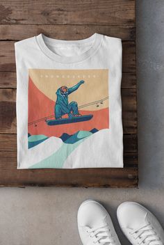 Keywords: UNISEX  Snowboarder T-Shirt ,Vintage Skiing T-Shirt | Ski Lover Hoodie | Skier Sweatshirt, Winter Sports Tee, Asiago Italy Top, Snow Mountain Shirt, Snowboarding Dad Gift Snowboard shirt Ski sweater skier accessories ------------------------------------------------ QUALITY This T-shirt is a UNISEX t-shirt with a vintage illustration and it feels soft and light, with just the right amount of stretch. It features a crew neck, pre-shrunk fabric and side-seamed fit. FIND YOUR SIZE Please find the fitting guide in the pictures to determine your size. Pro Tip: Choose the best size by comparing the measurements of your favorite T-Shirt with the ones listed on the chart. SHIPPING We work with a reliable, high-quality print-on-demand partner with locations in US and the EU, so depending o Ski Hoodie Design, White T-shirt For Outdoor Winter Activities, White Crew Neck Top For Snowboarding, Retro White Winter T-shirt, Vintage Skiing, Ski Vintage, Ski Print, Mountain Shirt, Sports Tee