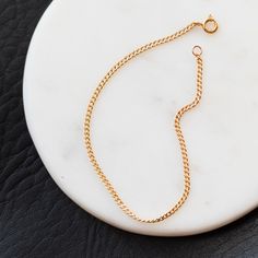 This Lily Curb Chain Bracelet is combination of classic elegance and modern minimalism - so you can get the best of both worlds! Crafted with either 14k gold filled or Argentium Silver (tarnish resistant), it's the perfect dainty accessory to stay on your wrist... for like, forever. Finally a high quality silver bracelet that is tarnish resistant! Argentium Silver is higher purity than sterling silver and made to withstand tarnish that typically comes with sterling silver. Details: Material: 14k Classic Adjustable Curb Chain Jewelry, Minimalist Gold Bracelet With Curb Chain, Classic Curb Chain Charm Bracelet For Everyday, Classic Charm Bracelet With Curb Chain For Everyday, Minimalist Gold Bracelet With Curb Chain For Formal Occasions, Classic Gold Plated Chain Bracelet With Curb Chain, Minimalist Gold Plated Curb Chain Bracelet, Minimalist Gold-plated Curb Chain Bracelet, Classic Gold Plated Curb Chain Bracelet