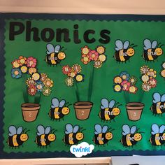 a bulletin board with flowers and bees on it that says phonics in front of them