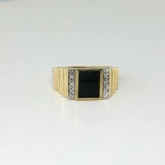 10K Yellow Gold Black Onyx and Diamond Ring, 10 round diamond white gold sets, with rectangular 8x10mm black onyx center 3/8 inch across, Ring size 11, Circa 1950, 6.5 grams SKU # BB287MR20 This listing contains photographs of the actual item you will receive. Our items are in excellent condition with little or no signs of wear and many are one of a kind pre-owned estate finds. Please look closely at the pictures in this listing as they are part of the product description. Please read the descri Formal Black Jewelry With Rectangular Stone, Black Rectangular Stone Ring For Anniversary, Classic Rectangular Collectible Jewelry, Black Rectangular Anniversary Ring, Black Rectangular Jewelry For Formal Occasions, Black Rings With Rectangular Stone For Anniversary, Formal Black Jewelry With Rectangular Shape, Timeless Black Diamond Ring For Formal Occasion, Classic Black Ring With 17 Jewels