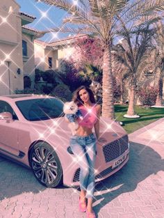 a woman standing next to a pink car with palm trees in the background and an image of a person holding a small dog