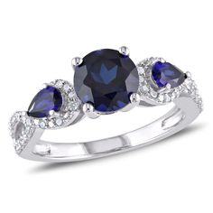 three stone ring with blue sapphires and diamonds