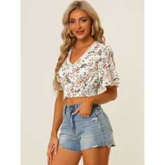 The floral cropped top is a summertime essential with its smocked hem and sweet flare short sleeves. The vintage-inspired floral print blossoms on this chiffon blouse, enhanced by gracefully flared sleeves. It offers a romantic look with its shirred hem, perfect for casual outings, vacations, or daily wear. Pair it with shorts, jeans, or skirts for a sweet look. The model is wearing size XS, and the top is designed for a regular fit. Made from 100% polyester, it is machine washable in cold water Fit Clothes, Fits Clothes, Sleeve Packaging, Women's Blouses, Holiday Vacation, Shorts Jeans, Chiffon Blouse, White Crop Top, Chic Woman