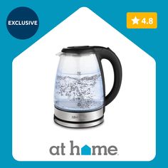 an electric kettle with water in it and the words at home above it on a blue background