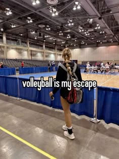 a woman standing in front of a tennis court with the words volleyball is my escape