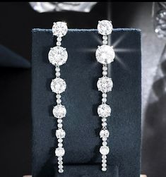 New to our Bella CollectionAnother beauty, glamorous simple, elegant and beautiful long drop swarovski crystal earrings. approx 3 1/2 " long pierced--------------------------------------------(add elegant classic tennis bracelet at discounted price) *Note processing time is not shipping time, our regular Free shipping takes approx. 5-6 days to receive after shipped. With rush processing your order is expedited and you will also be upgraded to priority mail approx 2-3 days to arrive once shipped Bridal Earrings Drop, Long Drop Earrings, Swarovski Crystal Earrings, Crystal Drop Earrings, Crystal Drop, Tennis Bracelet, Bridal Earrings, Crystal Earrings, Bridal Style