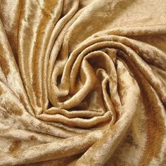 a close up view of a gold colored fabric