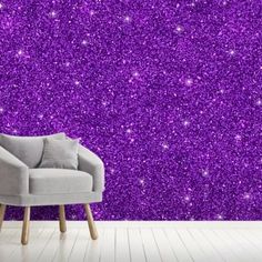 purple glitter wallpaper in a living room with a grey chair and white flooring