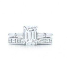 an emerald cut diamond engagement ring with side stones