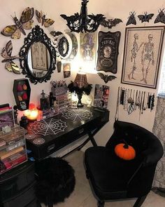 a halloween themed desk and chair in a room with lots of decorations on the wall