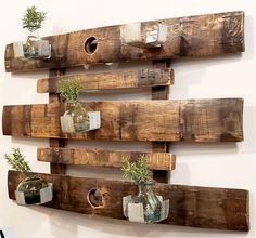 Our Reclaimed Whiskey Barrel Staves Wall Garden Planter / Candle Holder has been handcrafted in the USA by skilled artisans who have disassembled a reclaimed whiskey barrel and created a wall décor piece, preserving both the staves and barrel rings to create this beautiful wall accent. The staggered wood has five metal plant/candle holders which can accompany up to a 4” pot or 3.5” candle or bottle. Mason Jar On Wood Hanging, Barrel Stave Wall Art, Barrel Stave Art, Wood Diy Decor, Diy Outdoor Candles, Pallet Candle, Barrel Stave Ideas, Wine Barrel Art, Plant Candle