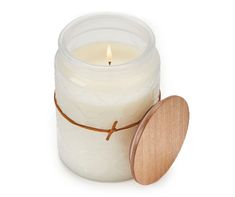 a white candle with a wooden lid on a white background