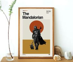 a poster with the character darth vader on it next to a potted plant