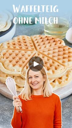 a woman standing in front of waffles with the words waffleteg on it