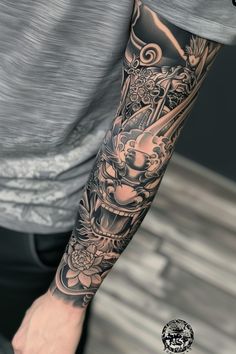 a man with a tattoo on his arm