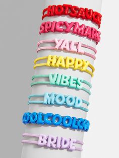 Whether it's a life motto, favorite mantra, or something you hold close to your heart, say it all with our new bracelet. This slider bracelet is the grown-up version of the jelly sandals from your childhood strung across a vibrant pull-tie cord. Flexible, fun, and featuring a range of moods, phases, and things you might love, this bracelet is meant to be worn alongside a bevy of other bracelets. Eternity Bracelet, New Bracelet, Life Motto, Pave Beads, 20 Off Sale, Custom Tiles, Gold Bead Bracelets, Happy Vibes, Rainbow Beads