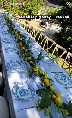 a long table is set with plates and lemons on it for a birthday party