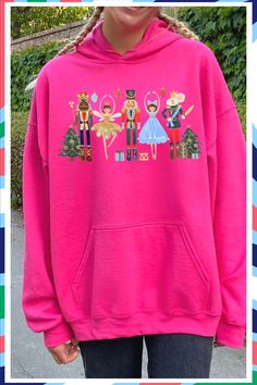 Adorable waatercolor Nutcracker Christmas sweatshirt can be made as a hoodie, crwneck or t-shirt. The PERFECT gift for a ballerina or anyone who loves the Christmas season. Pink Cotton Holiday Sweatshirt, Winter Cartoon Print Pink Sweatshirt, Winter Fun Sweatshirt With Cartoon Print, Fun Winter Sweatshirt With Cartoon Print, Christmas Graphic Print Long Sleeve Hoodie, Christmas Cotton Crew Neck Hoodie, Christmas Cotton Hoodie With Crew Neck, Fun Winter Hoodie Top, Christmas Cotton Hoodie Top