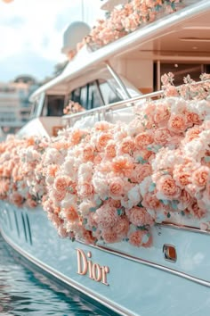 a boat with flowers on the side of it