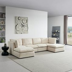 a living room with a large white sectional couch