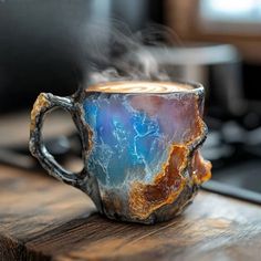 a cup that is sitting on top of a table with steam coming out of it