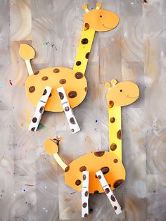 two giraffes made out of construction paper