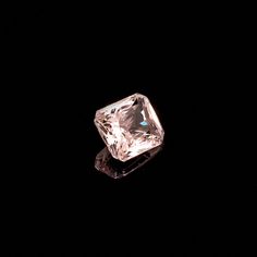 an uncut diamond on a black background