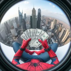 a man in spider - man suit looking out from the top of a building with money