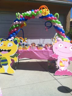 a table topped with balloons and decorations for a kids's birthday or baby shower