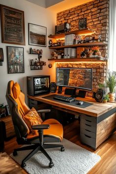 a home office with a brick wall and computer desk, orange leather chair, and black framed pictures on the wall