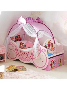 Create a magical kingdom for your little one with the Disney Princess Carriage Bed.  Inspired by the magical world of Disney, this Bed features a whimsical carriage design complete with a seat, storage boxes, and a full canopy fit for royalty. With its sturdy construction and elegant details, it not only provides a comfortable and safe sleeping space but also adds a touch of fairy tale charm to any bedroom. This is the perfect way to bring a touch of Disney magic to your little dreamer's bedroom. In fact, they might not object to hearing the word "bedtime" any more! Depth: 73 CM Height: 135 CM Material Content: MDF/Polyester-With full canopy Width: 170 CM Age Range: Child (3-8 years) Assembly: Part Assembled Made of Engineered Wood and Polyester Design includes your favourite characters su Disney Princess Carriage Bed, Disney Princess Toddler Bed, Toddler Canopy Bed, Princess Bedroom Set, Princess Carriage Bed, Princess Toddler Bed, Disney Princess Bedding, Princess Bedroom Ideas, Carriage Bed