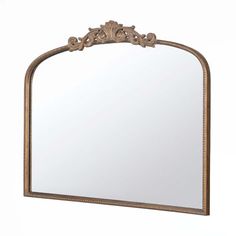 an ornate gold framed mirror against a white background with clippings on the edges